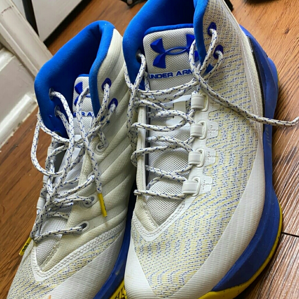 White blue and yellow under armour shoes